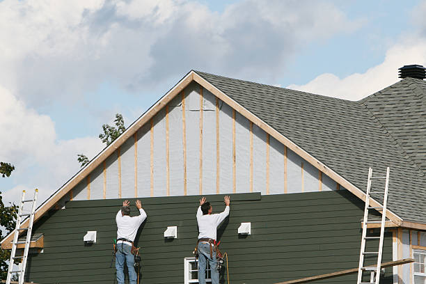 Professional Siding Installation technician working in Milton, MA